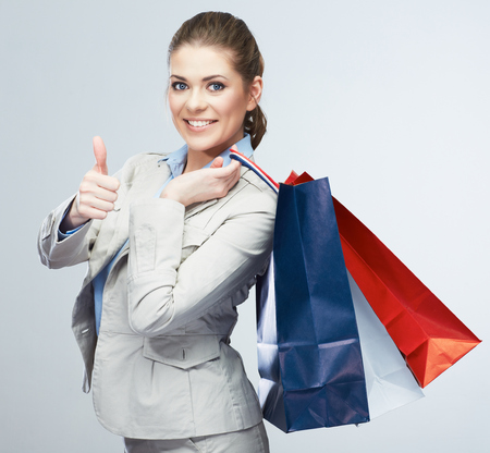 Young woman shopping bag hold. Female studio portrait isolated background.の写真素材