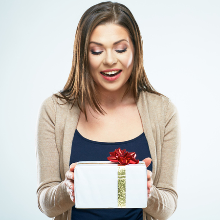 Happy woman hold gift box. White background isolated.の写真素材