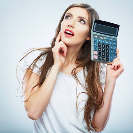 Isolated woman white dress hold count machine. Isolated female portrait. Beautiful worker girl.の写真素材