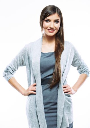 Business woman standing against white background. Smiling female business model studio  posing.の写真素材