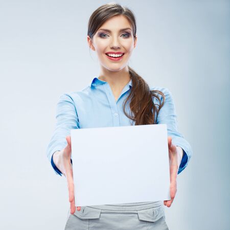 Business woman hold banner, white background  portrait. Female business model. Smiling girl isolated.の写真素材
