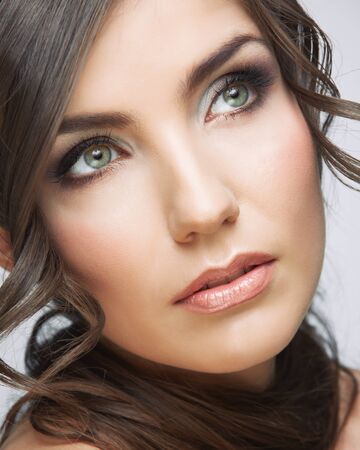 Beauty woman face close up portrait. Light make up. Female model studio posing.の写真素材