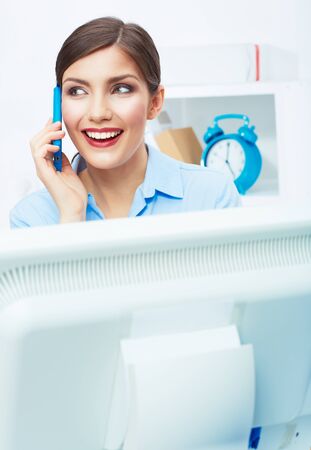 Portrait of smiling business woman call center operator at work. Young female business model.の写真素材