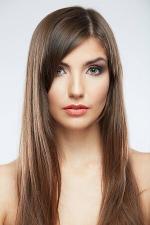 Beautiful young woman portrait isolated on studio background. Close up face. Long hairの写真素材