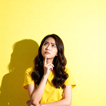 Young Asian Woman Thinking with Confused or Doubtful Expressionの素材