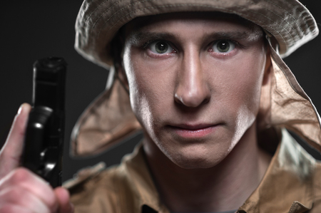 Military, war, conflict, soldiers - Special forces soldier with a gun on dark backgroundの写真素材