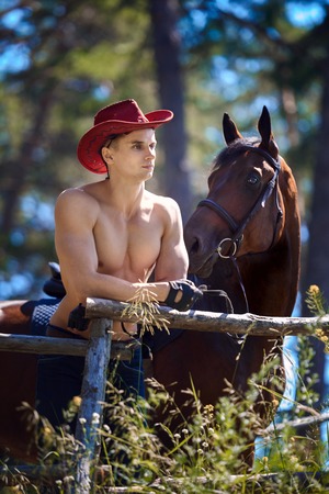 Macho man handsome cowboy and horse. Western styleの写真素材