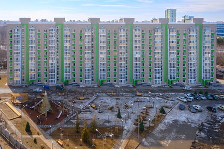 Facade of a tall residential building. High-rise buildings modern architecture skyline.の写真素材