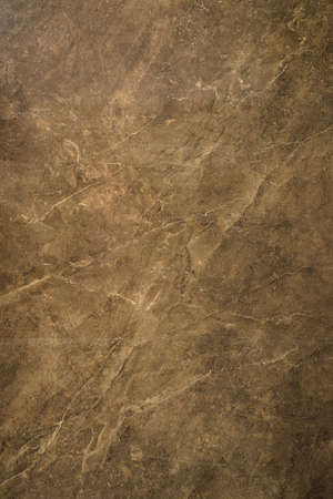 Ceramic porcelain stoneware tile texture or pattern. Natural stone brown color with veiningの写真素材