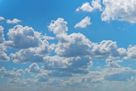 Blue sky and airy white clouds in sunny weather