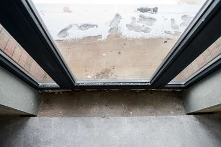 The room is under construction with a rough finish, plastered walls, concrete floor. Wiring of...