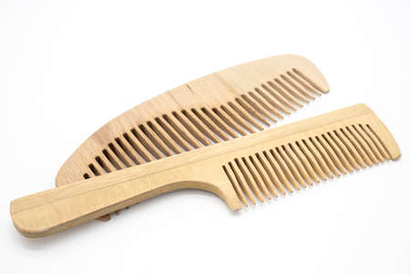 Wooden comb with handle on white backgroundの写真素材