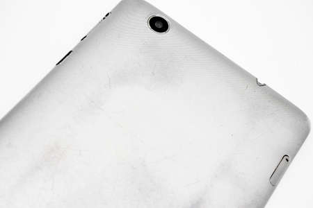 Old shabby smartphone with a broken screenの写真素材