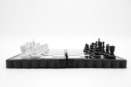 Pocket plastic chess game, checkers on magnets isolated on white background