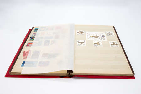 Album of used stamps isolated on white backgroundの写真素材