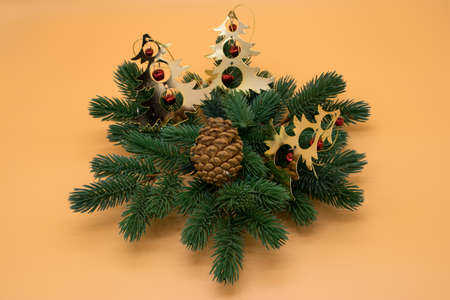 Christmas tree branch with pine cone and decorationsの写真素材