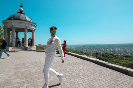 Pyatigorsk, Stavropol Territory, country Russia 01/05/2018 A Handsome guy posing in Pyatigorsk near the sights of the Eolian Harp on Mount Mashukのeditorial素材