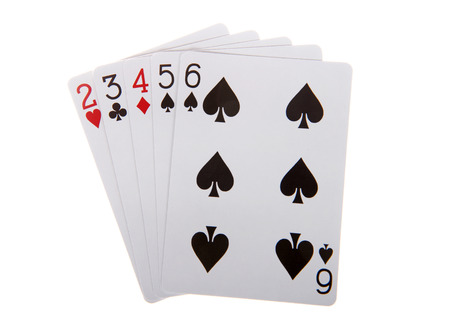 Playing cards a straight. Five cards in sequence of mixed suits. The straight that has the highest card is the winner.の写真素材