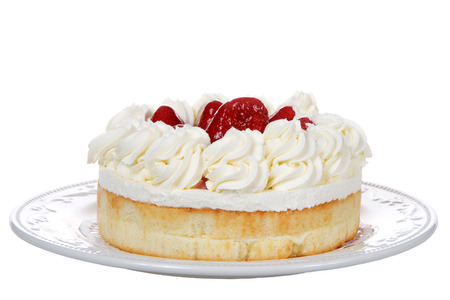 Porcelain plate with large strawberry shortcake dessert isolated on white backgroundの写真素材
