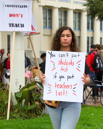Oakland, CA - January 18, 2019: Oakland teachers having a one day "sick out" to protest slow progress on contract talks with the district. Fighting for smaller class sizes and bigger paychecks.のeditorial素材