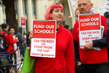 Oakland, CA - January 18, 2019: Oakland teachers having a one day "sick out" to protest slow progress on contract talks with the district. Fighting for smaller class sizes and bigger paychecks.のeditorial素材