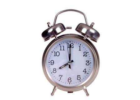 Old fashioned style alarm clock set to 8 o'clock. 8 AM is a common start time for grade school...
