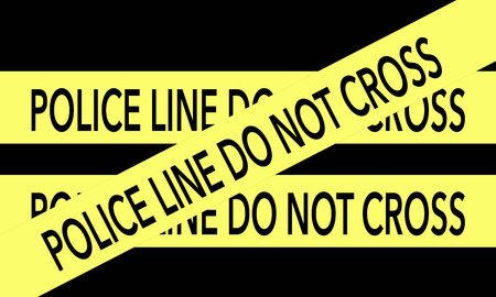 Police line do not cross yellow tape on back background.の写真素材