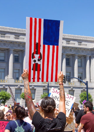San Francisco, CA - June 30, 2018: Thousands of protestors in a "Families Belong Together" march to City Hall, protesting Trump's "Zero Tolerance" policy and the separation of more that 2,000 childrenのeditorial素材