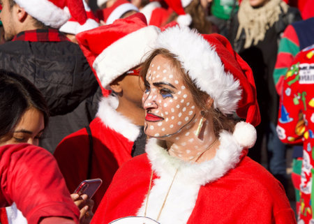 San Francisco, CA - December 8, 2018: Unidentified participants in the 24th annual Santa Con, held at Union Square. An annual city wide Santas only pub crawl and toy donation to charity.のeditorial素材