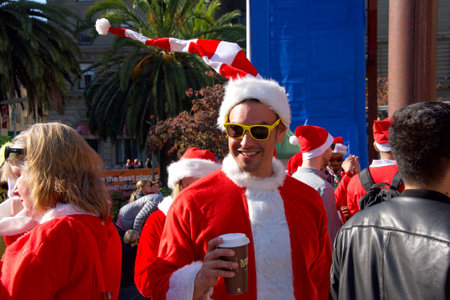 San Francisco, CA - December 8, 2018: Unidentified participants in the 24th annual Santa Con, held at Union Square. An annual city wide Santas only pub crawl and toy donation to charity.のeditorial素材