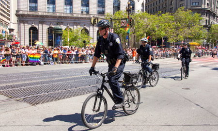 San Francisco, CA - June 24, 2018: Police patrolling during the 48th annual Gay Pride Parade, one of the oldest and largest LGBTQIA parades in the world hosting over 280 contingents this year.のeditorial素材