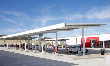 Kettleman City, CA - February 02, 2017: Tesla Supercharger station with 40 charging stations all on solar power. Supercharger stations allow Tesla cars to be fast-charged at the network within a hour.のeditorial素材