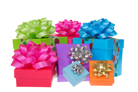 Many brightly colored boxes presents with colorful bows. Holiday shopping wrapped. Isolated on a white background.の写真素材