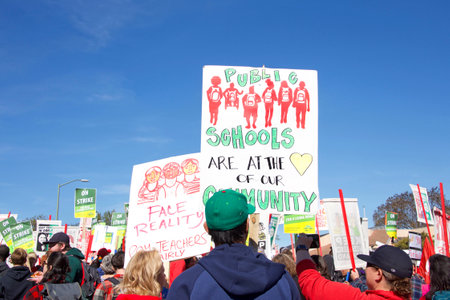 Oakland, CA - February 22, 2019: Unidentified participants at Oakland teachers strike day 2 rally at DeFremery Park, then marching downtown. Fighting for smaller class sizes and bigger paychecks.のeditorial素材