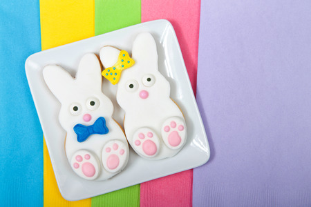 Easter Bunny Sugar Cookies on a square plate with napkins underneath. Marshmallow fondant covered...