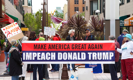 Oakland, CA - June 15, 2019: Unidentified protesters with signs in front of the Federal Courthouse,...