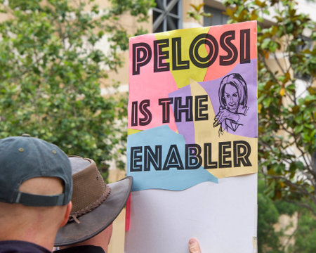 Oakland, CA - June 15, 2019: Unidentified protesters with signs in front of the Federal Courthouse, demanding an inquiry into the impeachment of Donald Trumpのeditorial素材