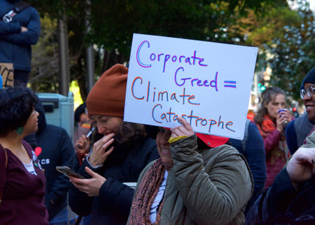 San Francisco, CA - Dec 16, 2019: Unidentified protesters outside PG&E headquarters and blocking traffic at Market and Beale. Among demands is for the company to become a public owned utility.のeditorial素材
