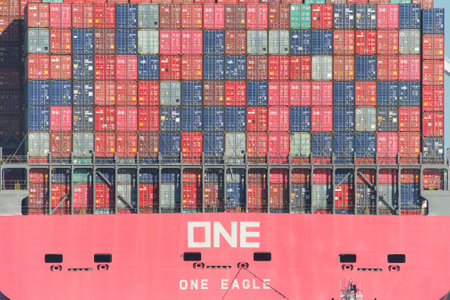 Oakland, CA - June 3, 2020: Cargo Ship ONE EAGLE departing the Port of Oakland loaded with shipping containers. Containers are organized and placed algorithmically for efficient transport.のeditorial素材