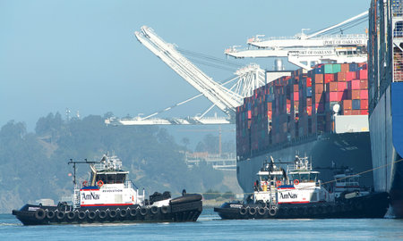 Oakland, CA - June 30, 2020: Tugboats REVOLUTION and INDEPENDENCE assist CMA CGM A. LINCOLN to maneuver into the Port of Oakland, the fifth busiest port in the United States.のeditorial素材