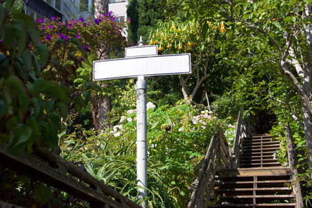 Blank street sign on secluded stairway entrance to secluded houses on hillside. Difficult entry access.の写真素材