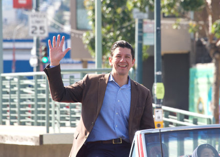 San Francisco, CA - Feb 18, 2023: Assessor Recorder Joaquin Torres in the Black History Parade, going down 3rd Street in the Bayview Hunters Point neighborhood.のeditorial素材