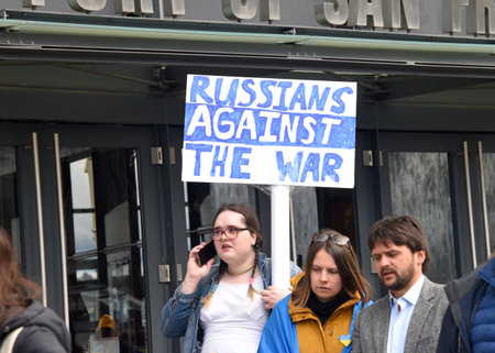 San Francisco, CA - Feb 25, 2023: Participants at Unite for Ukraine March from Harry Bridges Plaza on the Embarcadero to Pier 39.のeditorial素材
