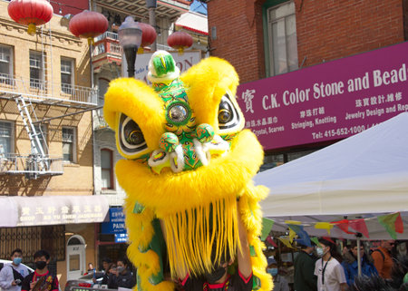 San Francisco, CA - April 15, 2023: Participants at the CYC Spring Festival at Waverly Place in Chinatown. Close up on Dragon danders performing in the streets.のeditorial素材