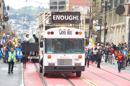 San Francisco, CA - April 8, 2023: Participants in the Drag Up Fight Back protest marching from Civic Center to Union Square. Holding signs.のeditorial素材