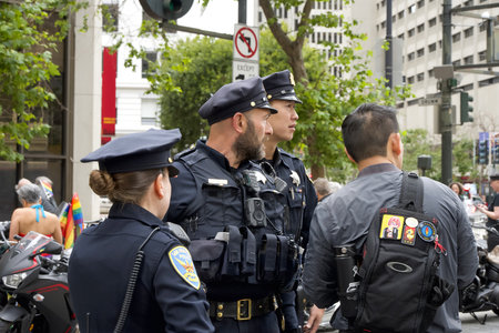 San Francisco, CA - June 24, 2023: SFPD officers patrol the route prior to the SF Gay Pride Parade...
