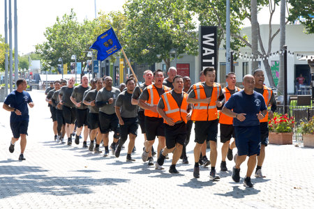 Oakland, CA - Aug 23, 2023: 192nd Oakland and Fremont Police Academy class running through Jack London Square during training exercises. Said to be a rigorous, 26-week training program.のeditorial素材