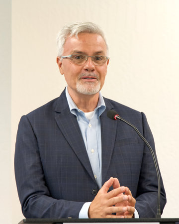 Oakland, CA - Aug 22, 2023: Port of Oakland Commissioner Michael Colbruno speaking at a press conference with Mayor Sheng Thao regarding flight school coming to Oakland.のeditorial素材
