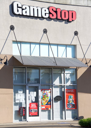 Fruitvale, CA - Jan 29, 2021: Store front of GameStop. Many posters and advertisements on the door...