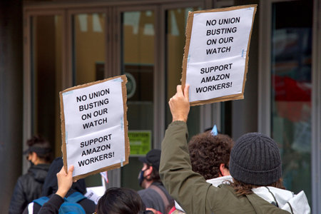 Oakland, CA - Feb 20, 2021: Unidentified participants protesting Amazon's treatment of employees and...